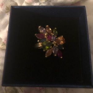 Brand new multi colored stones on gold color ring